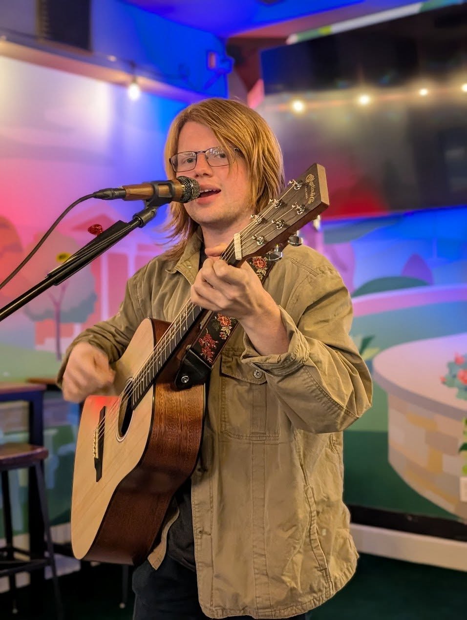 Singer and guitarist performing live on stage